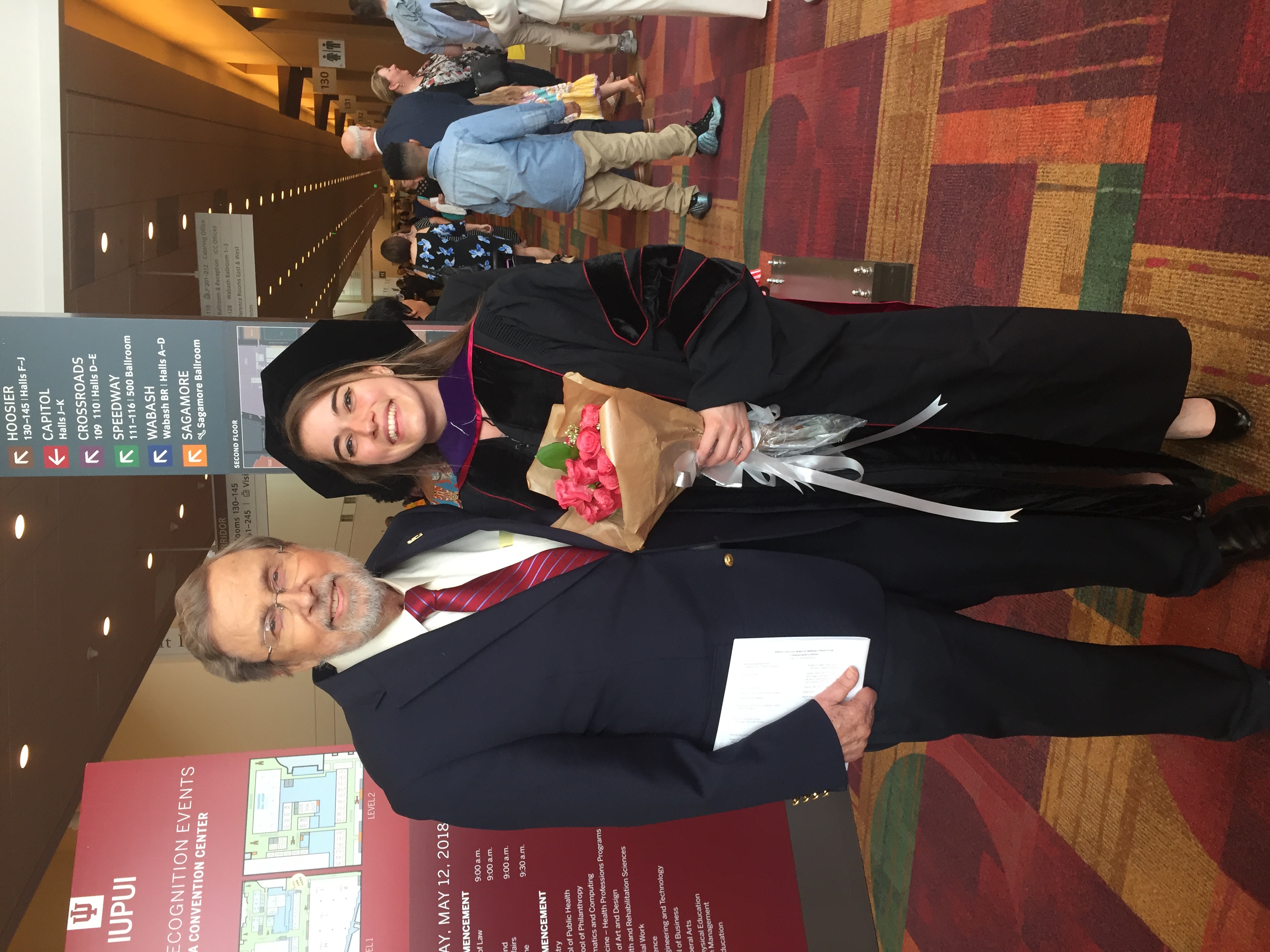 Victoria at her graduation with her grandfather